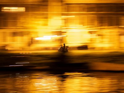 Abstract motion blur of a person moving during yoga.