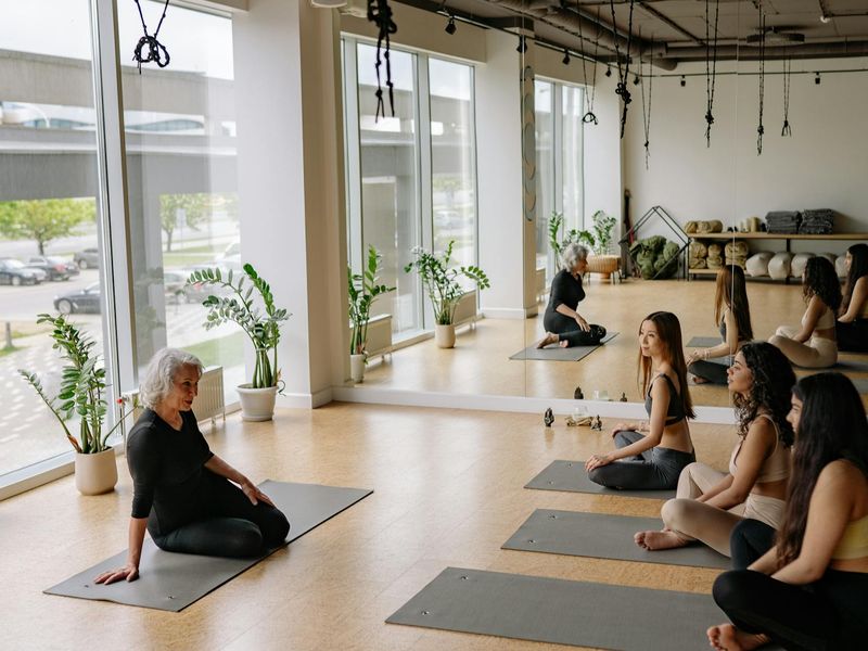 Interior of a modern yoga studio with ambient lighting.